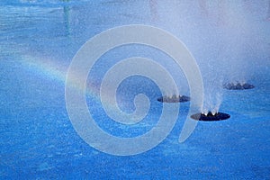 Rainbow and water fountain background