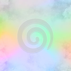 Rainbow watercolor background painting in pastel pink blue white and yellow green colors with painted watercolor wash