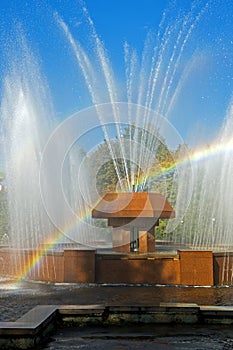 Rainbow in the waterdrops of a fountain