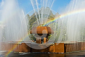 Rainbow in the waterdrops of a fountain