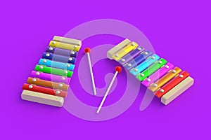 Rainbow xylophones on violet background. Kids toy. Preschool education. Musical instrument