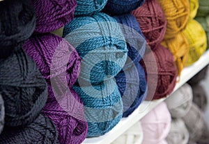 Rainbow of yarn or wool on a shelf