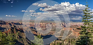 Rainclouds over a wide Grand Canyon landscape