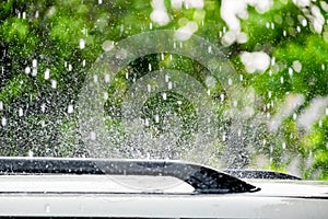 Raindrop falling on car