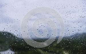 Raindrop on glass blur nature background