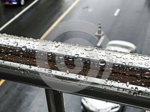 Raindrop on stainless steel in rainy day