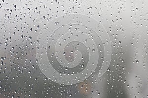 Raindrop, water drops on a glass surface of window