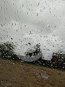 Raindrops background on glas