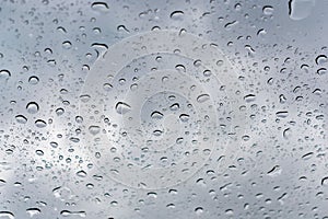 Raindrops beading on the sunroof on a rainy day