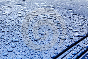 Raindrops on a blue car body with Hydrophobic Effect