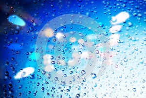 Raindrops on a blurred multicolored bokeh background