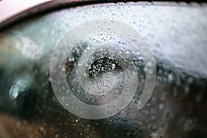 Raindrops on the car glass.