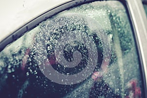 Raindrops on the car glass.