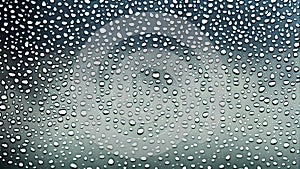 raindrops on car window.water drops background.weather gray background. Rain gray clouds glass texture