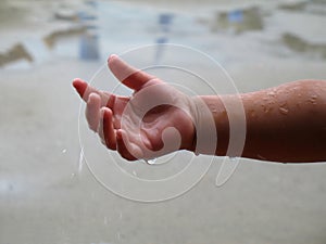 Raindrops child hand