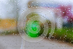 Raindrops on glass of car
