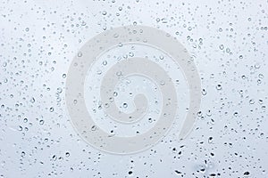 Raindrops on glass, closeup, texture