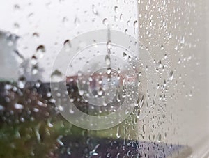 Raindrops on the glass, outside the window a heavy downpour