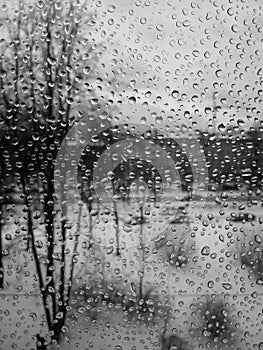Raindrops on the glass, rain in the new year, rain with snow, wet weather, rainy weather, depression, gray sky
