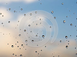 raindrops on glass sky texture. Pure blue fresh clean. Window view background screensaver. Place for text banner.