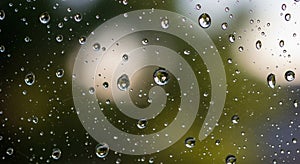 Raindrops on a glass surface create