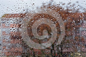 Raindrops on the glass. Window in March. Season specific. Portugal. Almada. Early spring. photo