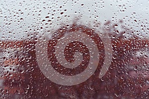 Raindrops on the glass. Window in March. Season specific. Portugal. Almada. Early spring. photo