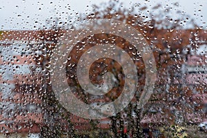 Raindrops on the glass. Window in March. Season specific. Portugal. Almada. Early spring. photo