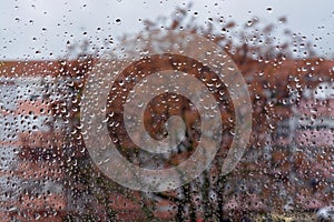 Raindrops on the glass. Window in March. Season specific. Portugal. Almada. Early spring. photo