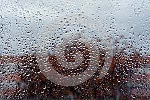 Raindrops on the glass. Window in March. Season specific. Portugal. Almada. Early spring. photo