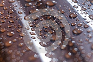 Raindrops on the metal profile sheet. Brown profiled metal sheet with dew drops