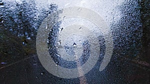 Raindrops at the rear windshield of the car