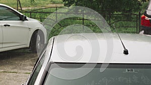 Raindrops on a silver car close-up