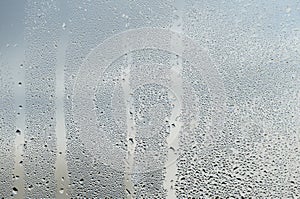 Raindrops and Water Runs on a Glass Window Pane