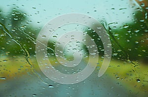 Raindrops on a wet car windshield