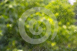 Raindrops. Wet window glass during the rain.