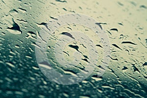 Raindrops on the window close up. rain drops on the glass macro. water drops falling down on window. rainy day