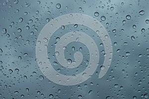 Raindrops on the window close up. rain drops on the glass macro. water drops falling down on window. rainy day