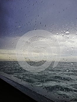 Raindrops on the window of the ferry