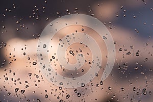 Raindrops on the window glass.