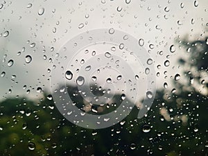 Raindrops on window glass , rainy day