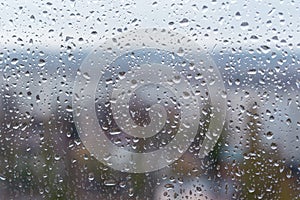 Raindrops on window glass surface, background texture