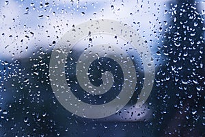 Raindrops on the window glass.