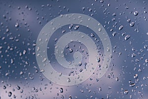 Raindrops on the window glass.