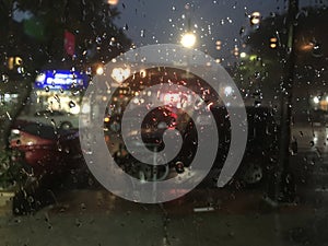 Raindrops on a window at night