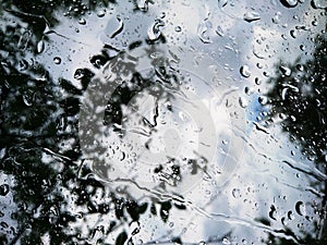 Raindrops on the window. Rainy weather water drops macro