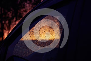 Raindrops on the windshield of a car