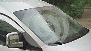 Raindrops on the windshield of a car