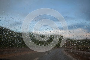 Raindrops on windshield of car