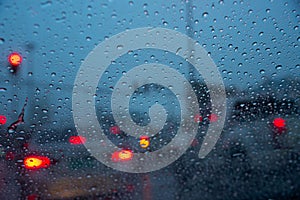 Raindrops on windshield car during traffic jam